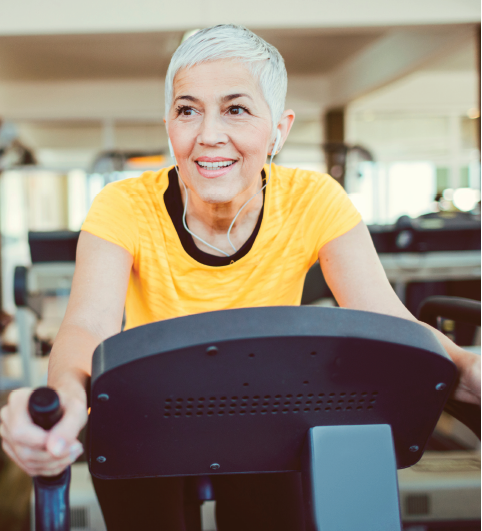 senior on stationary bike